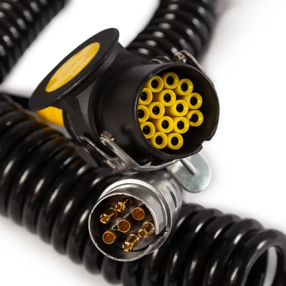 Heavy-duty multi-pin connector detail — 15-pin socket on black coiled cable